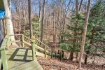 Take the stairs into the woods where you`ll find hiking trails 
